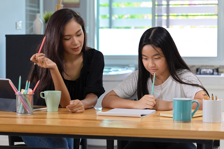 student and tutor together at a desk in Seattle